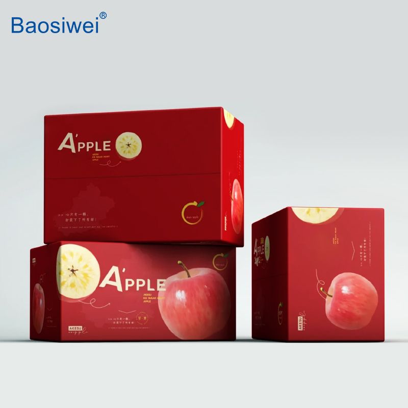 Printed fruit boxes with apple-themed design, featuring vibrant red tones and realistic fruit illustrations.