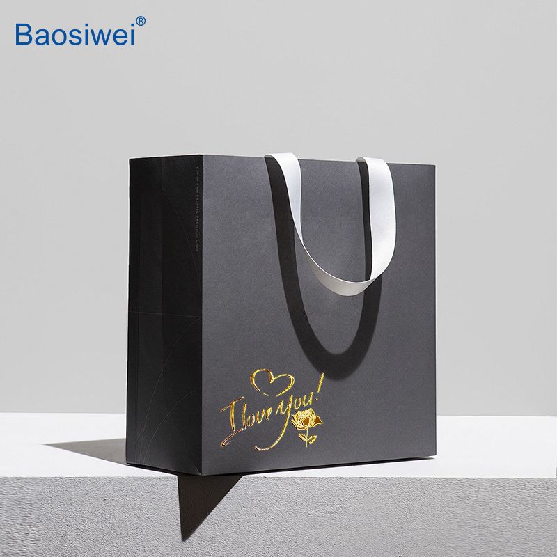 Gold foil crystal label design on a luxury black gift bag, perfect for branding and premium product packaging.