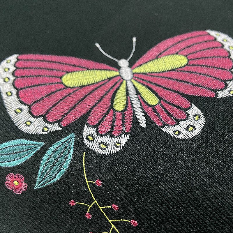 Close-up of a butterfly pattern with UV simulated embroidery, showcasing vivid colors and fine thread-like texture for a realistic embroidered look.