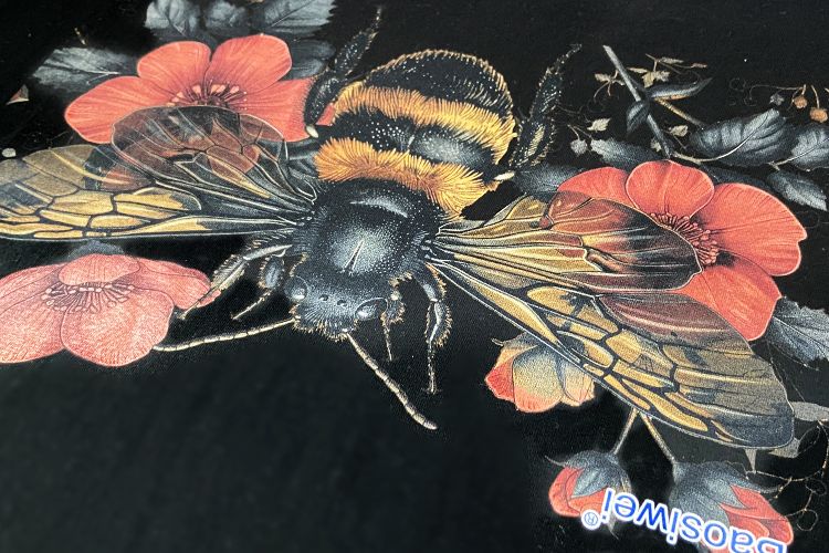 Close-up of bee design printed by Baosiwei DTG printer on black T-shirt