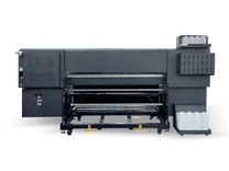 Baosiwei 热升华打印机背部结构展示，双轴收放料系统设计，支持长达万米卷材。